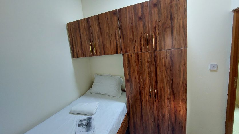 This picture includes a bed in a Room in Al Qusais available for rent