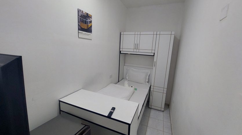 This picture shows a bed in a Large Partition in Al Qusais for rent.