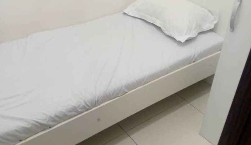 This image includes a bed in a Room For Rent in Al Quoz - Dubai