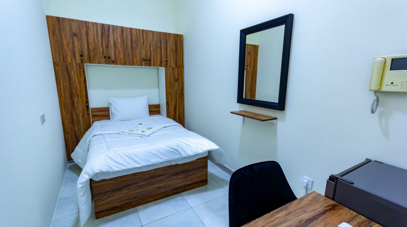 This picture includes a bed in a Room in Umm Suqeim for rent.