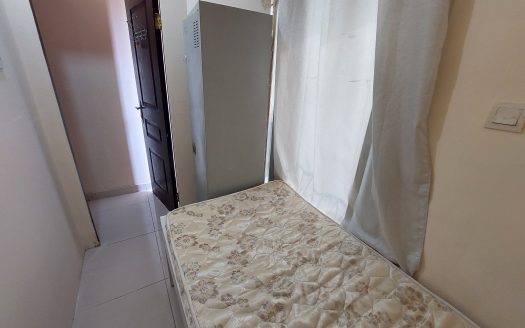 sunlit Small Room in Al Qusais for men in a well-maintained flat