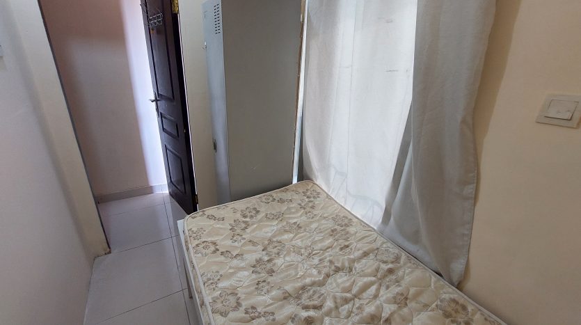 sunlit Small Room in Al Qusais for men in a well-maintained flat