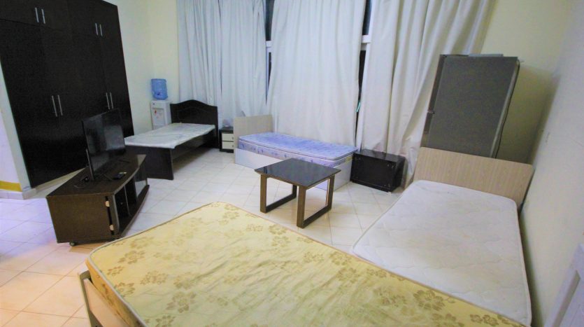 This picture shows a bed and treasure in a bed space in Tecom Al Fahed Tower