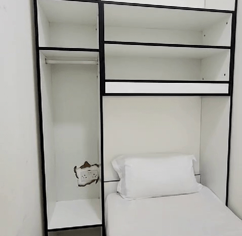 This picture includes a bed in a room for rent in Al Quoz - Dubai