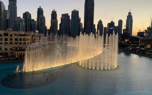 This picture shows Dubai Fountain with article about tourist places and activities in Dubai